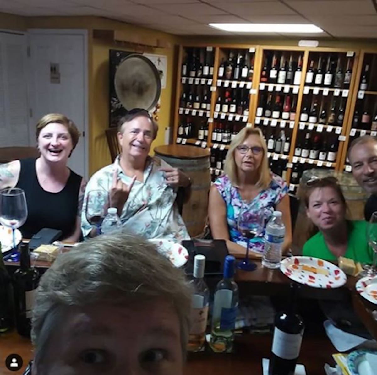 Image of 6 friends at the Casa Jimenez wine shop in Tampa drinking wine